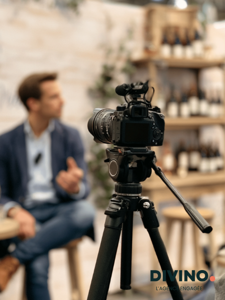 man talking while being filmed by a camera